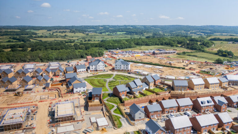 An aerial view of a housing development under construction with low carbon heating