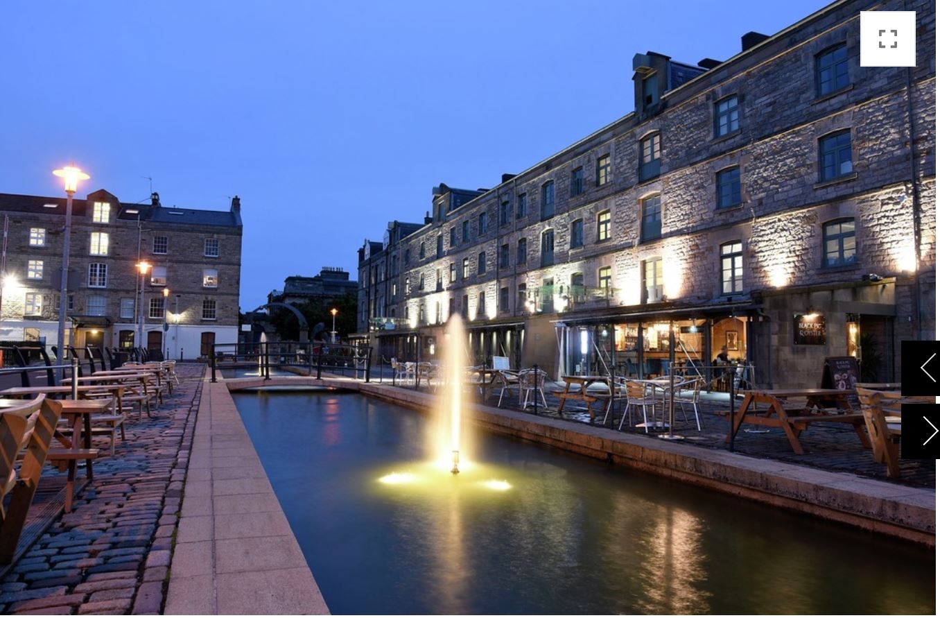 A view across the fountain at the Waterfront Plaza, a mixed-use urban development