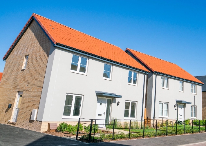 A street view of two detached new build homes with GTC utility connection services