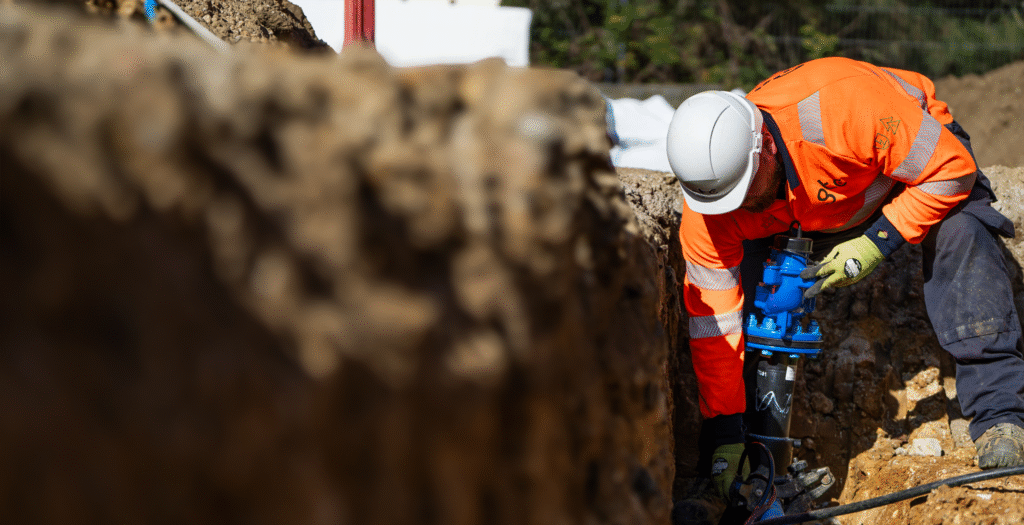 A GTC water engineer installs pipework to new build developments.