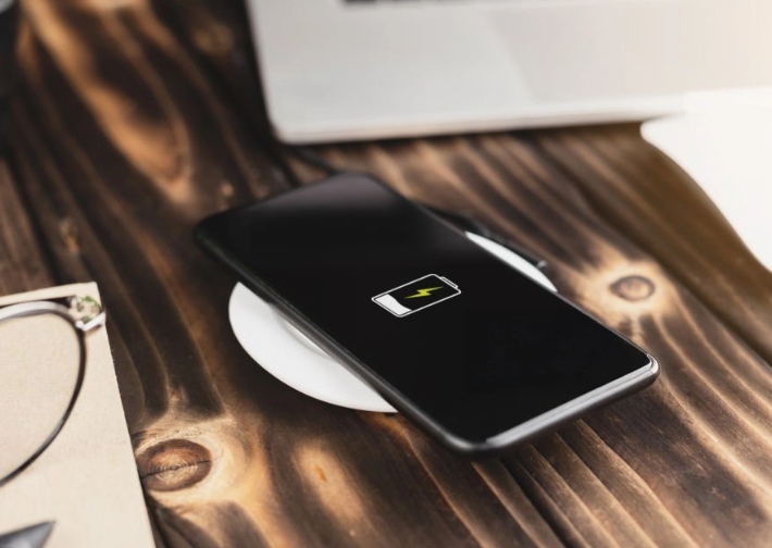 A smart phone charges on a table top in preparation of a planner power cut